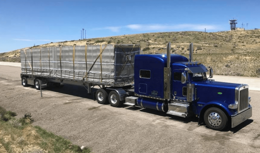 Bee Net cover on blue semi truck