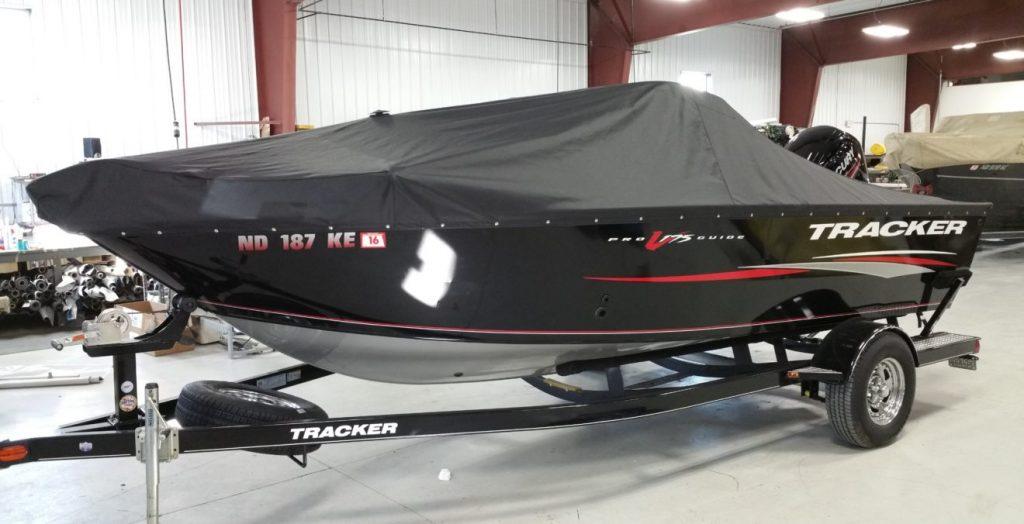 Tracker boat with black cover