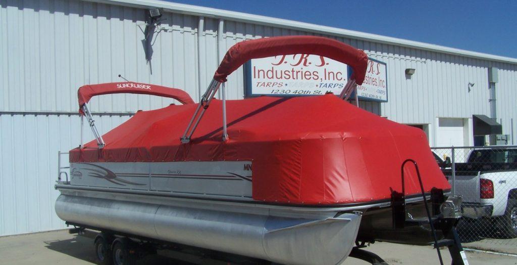 Suncruiser pontoon with red cover.