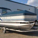 Northwood pontoon with blue cover