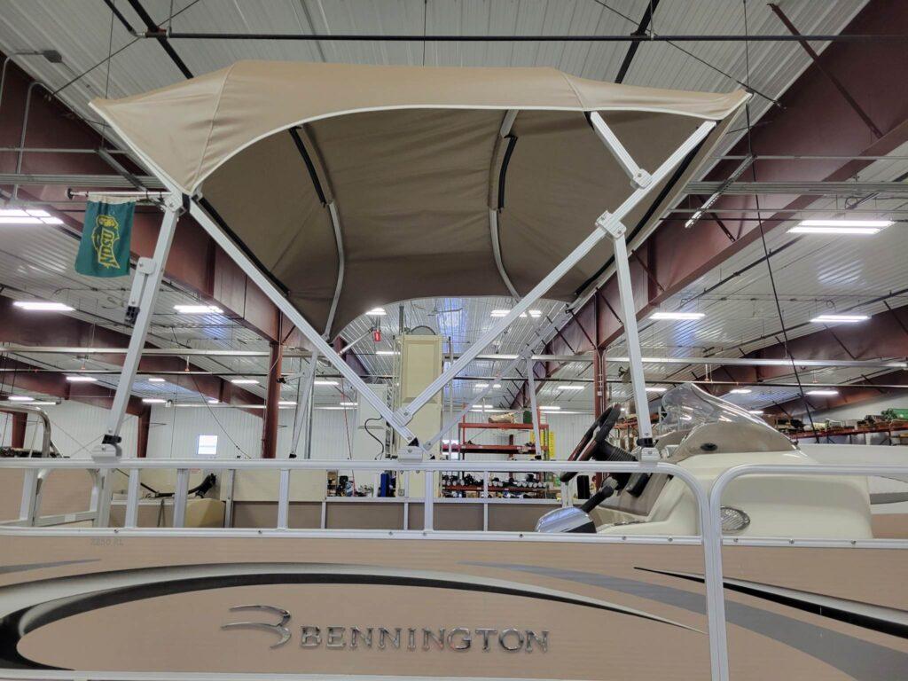 Bennington pontoon with a brown cover shelter