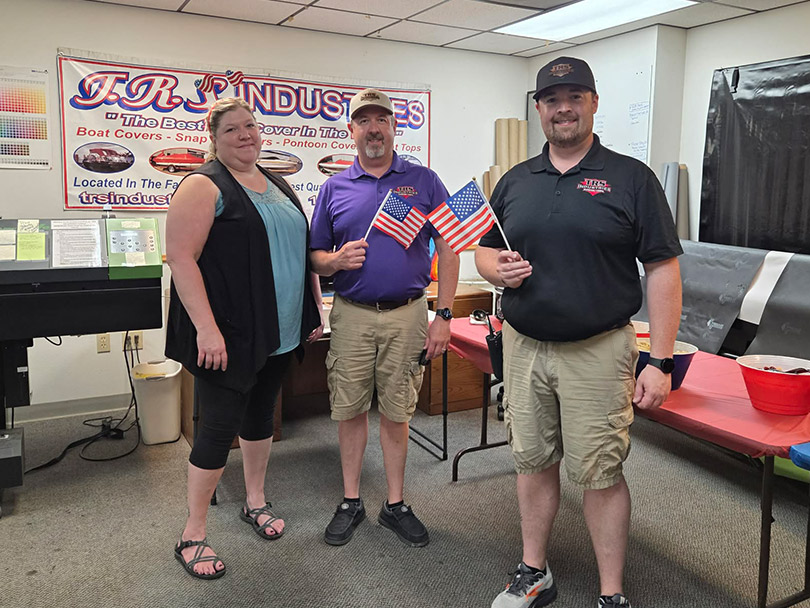 Life-At-TRS-Industries-2026 Team members enjoying a festive lunch holding American flags