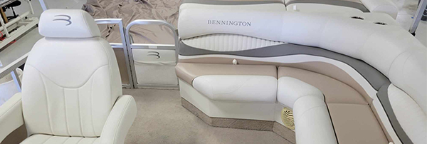 TRS_Industries_Custom_Fitted_Boat_Covers Overhead view of customized white and grey marine vinyl seating upholstery installed in a pontoon boat interior.