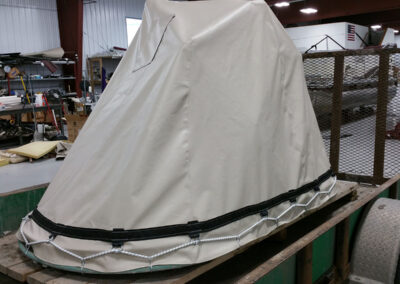 Custom fitted machinery cover protecting industrial equipment