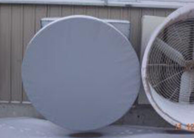 Additional grain bin fan cover on farm equipment