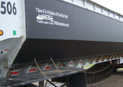 Black vinyl wind tamer panel mounted on a trailer