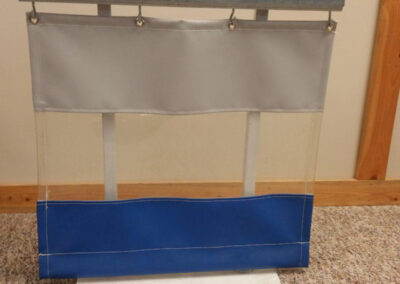 Combo demonstrations of transparent and colored vinyl curtain system demonstrating industrial track installation