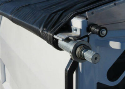 Detailed close-up of a trailer roll tarp system