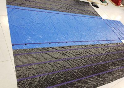 Commercial lumber tarp protecting transported cargo