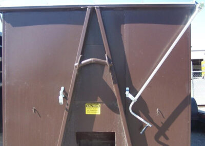 Construction refuse tarp system installed on a hauling trailer