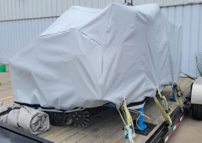 Protective fitted cover installed over industrial machinery