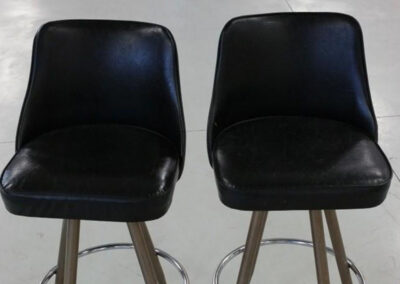 Custom upholstered bar stools with restored seating surfaces
