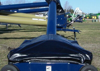 Custom fitted hopper tarp cover on agricultural equipment