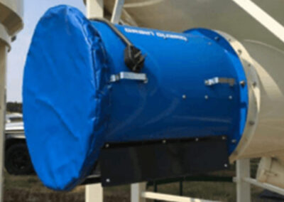 Protective cover installed on a grain bin fan system