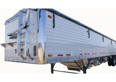 Heavy-duty electric roll tarp system mounted on trailer