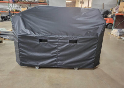 Custom protective cover installed on industrial machinery
