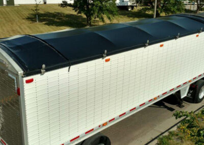 Industrial trailer equipped with a Supreme roll tarp system