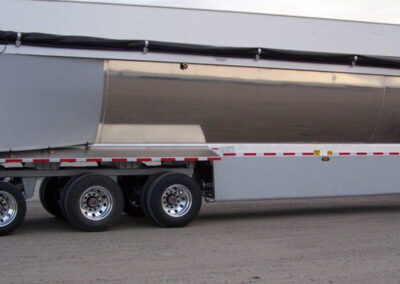 Lower trailer aerodynamic panel used as a wind tamer