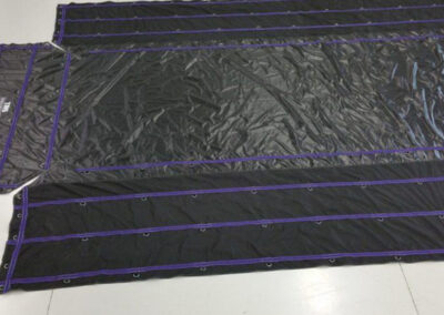 Lumber tarp featuring custom-colored webbing before installation