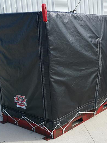 oil-rig-machinery-protective-covers-HOME A industrial-strength black protective cover wrapped securely around large-scale agricultural machinery.