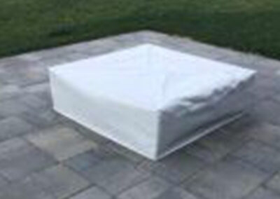 Outdoor fire pit and fireplace cover protecting exterior features