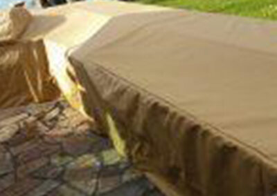 Protective cover installed over an outdoor kitchen setup