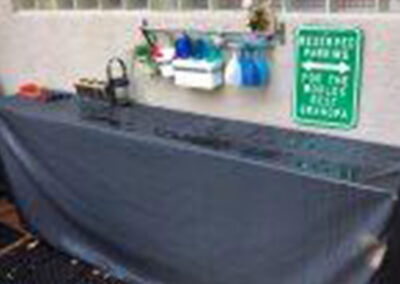 Fitted outdoor patio table cover protecting furniture from weather exposure