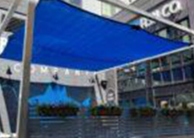 Custom outdoor mesh shade installation providing sun protection