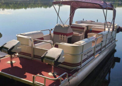 Pontoon boat equipped with a Bimini top canopy system