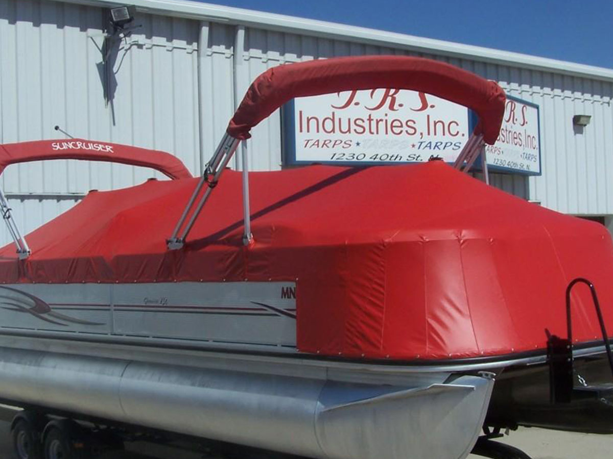 burgundy-bimini-top-with-clear-windshield Side view of a burgundy marine canvas bimini top integrated with a clear vinyl front windshield panel.
