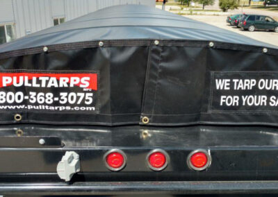 Rear perspective of a front-to-back trailer roll tarp