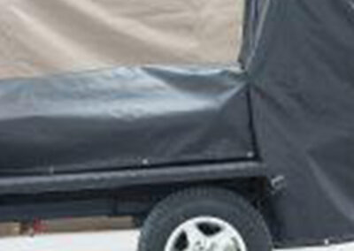 Custom smoker grill cover installed on a mobile trailer setup
