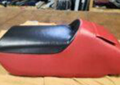 Restored snowmobile seat with custom upholstery