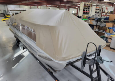 Standard fitted pontoon cover protecting a pontoon boat