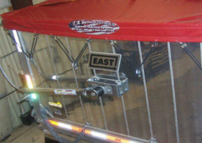 Side view of a Supreme roll tarp system on a trailer