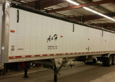 Supreme roll tarp system equipped with tarp tamer accessories