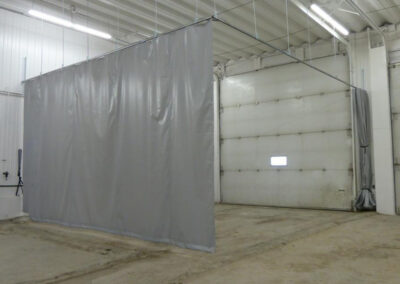 Garage curtain enclosure mounted using a threaded rod track system