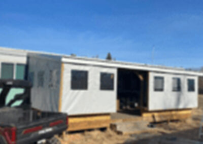 Vinyl fabric side panels installed on a trailer frame structure