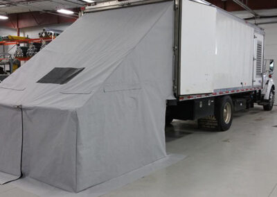 Rear enclosure cover attached to a tarp trailer system