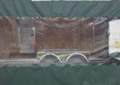 Tailgating trailer enclosure with custom door access and enclosed sides