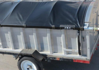 Trailer tarp system displaying multiple tarp material types