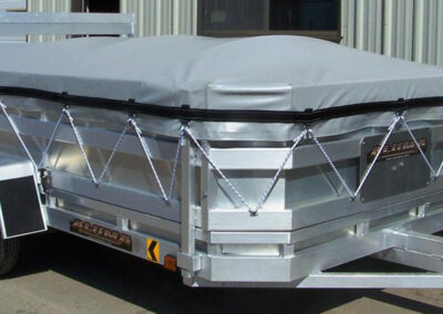 Custom fitted cover installed on a utility trailer